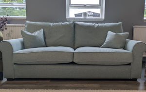 Blue sofa in a living room setting