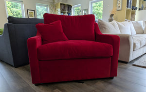 Red sofa with a gray and beige couch in a living room setting